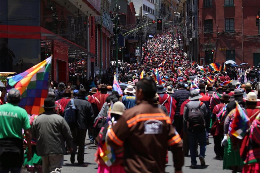 Bolivians gathered  in La Paz, with Wiphala flags in their hands to protest the coup.