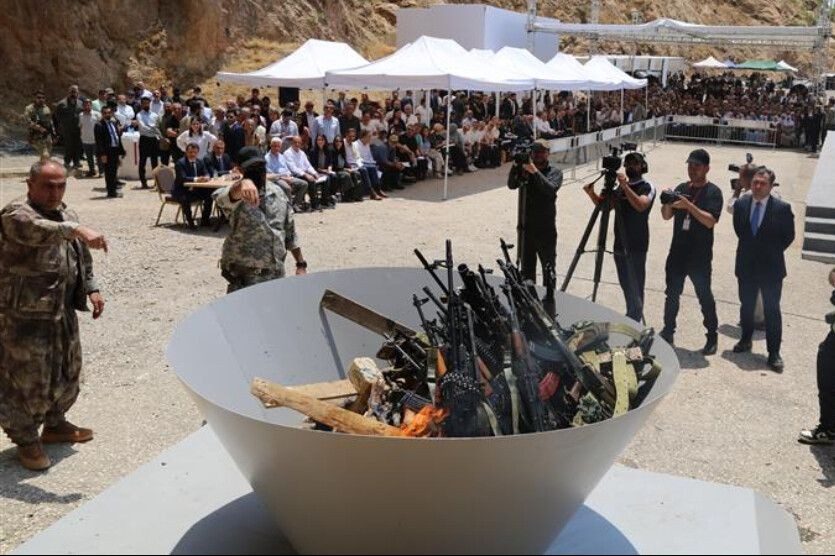 PKK begins laying down arms | Weapons set ablaze for peace