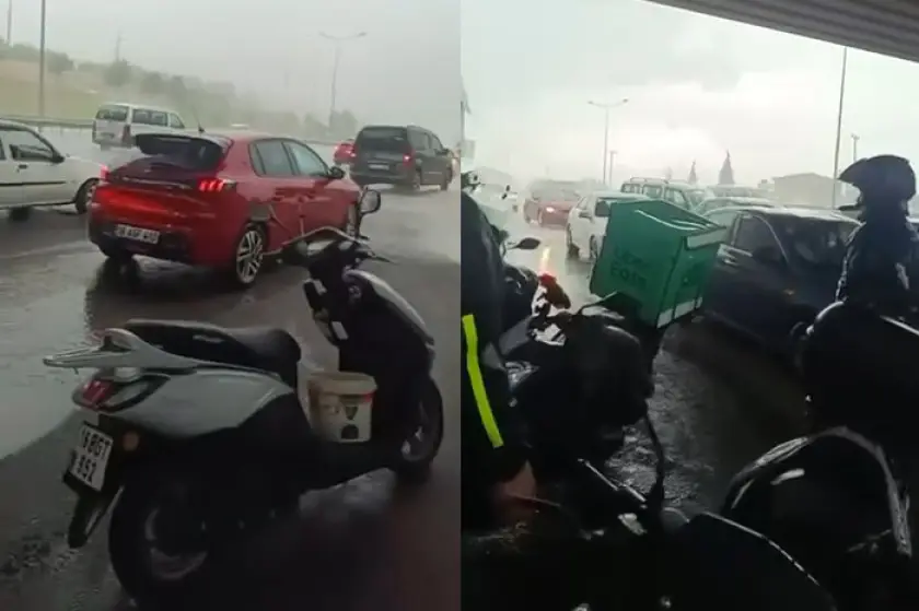 Sağanağa yakalanan motokuryeler köprü altına sığındı